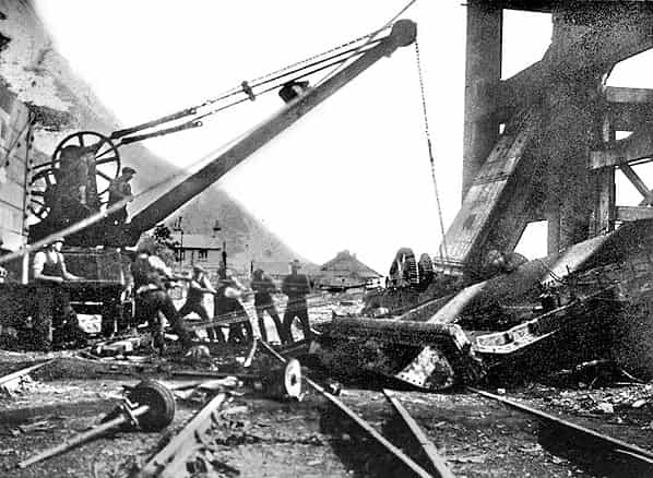 Demolition of Borehole shaft head at Shakespeare Colliery underway probably in 1928., submitted by Buddle-Bot on 05-10-2024.
Public Domain Demolition of Borehole shaft head at Shakespeare Colliery underway probably in 1928.