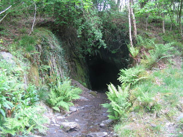 An underground view of Sygun Copper Mine showing the stalagtites and rock formations.
