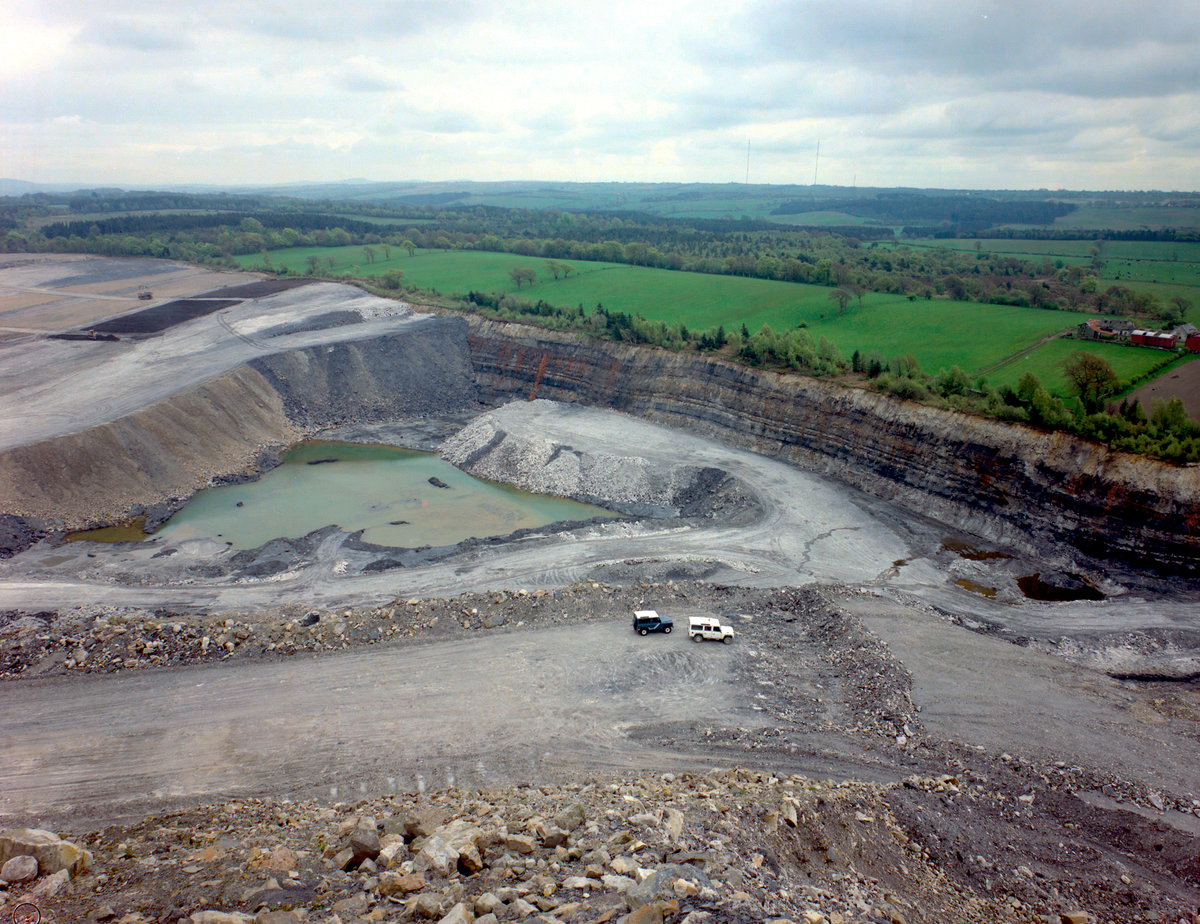 1993 - South Roughcastle opencast coal mining site, High Bonnybridge. West Lothian. View of the opencast excavation., submitted by Buddle-Bot on 08-11-2025.
Bgs No. P000221; MacTaggart, F.I.; © NERC. Image & Text: BGS Geoscenic, under OGL V2 License http://bit.ly/462AXmV 1993 - South Roughcastle opencast coal mining site, High Bonnybridge. West Lothian. View of the opencast excavation.