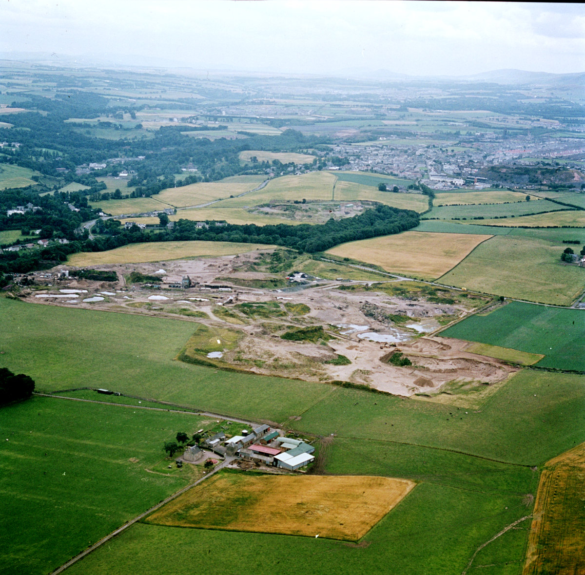 1979 - Aerial view of Melville Sand Pit (centre) and Haveral Wood Sand Pit, looking west towards Loanhead, Midlothian.