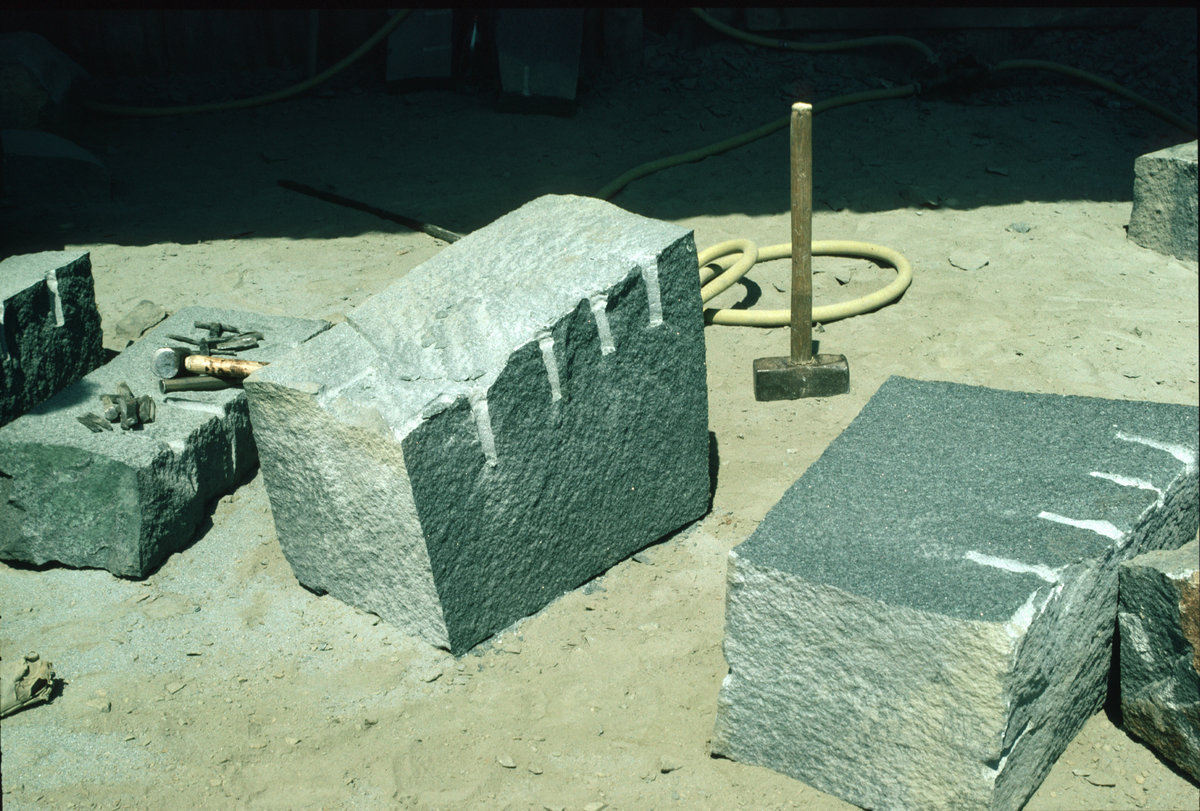 Jul 1984 - Beltmoss Quarry, Kilsyth, Strathclyde. Fashioning kerbs from quartz-dolerite. , submitted by Buddle-Bot on 08-11-2025.
Bgs No. P001617; Bain, T.S.; © NERC. Image & Text: BGS Geoscenic, under OGL V2 License http://bit.ly/462AXmV Jul 1984 - Beltmoss Quarry, Kilsyth, Strathclyde. Fashioning kerbs from quartz-dolerite.