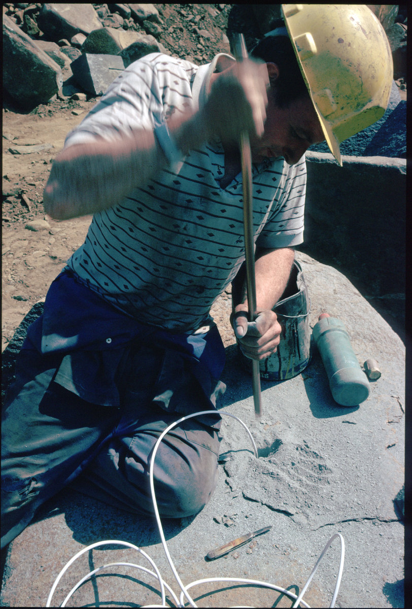 Jul 1984 - Beltmoss Quarry, Kilsyth, Strathclyde. Fashioning kerbs from quartz-dolerite. , submitted by Buddle-Bot on 08-11-2025.
Bgs No. P001619; Bain, T.S.; © NERC. Image & Text: BGS Geoscenic, under OGL V2 License http://bit.ly/462AXmV Jul 1984 - Beltmoss Quarry, Kilsyth, Strathclyde. Fashioning kerbs from quartz-dolerite.