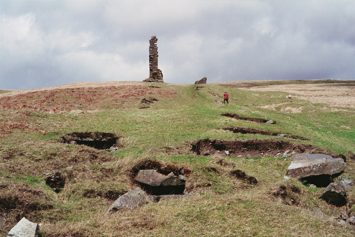1995 - Ruins of smelter chimneys and slab-roofed trench of flues, Woodhead lead Mine, Carsphairn, south-west Scotland.